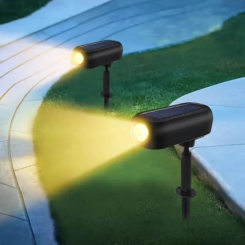 Two solar-powered outdoor lights illuminating a pool area.