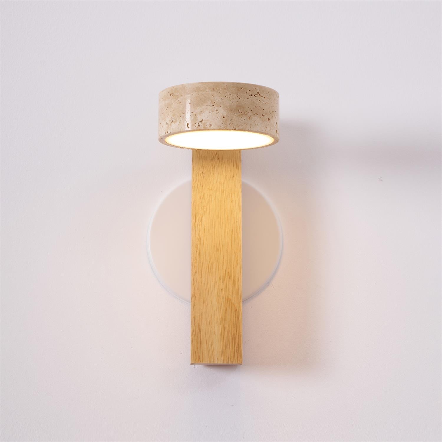 Wall-mounted light fixture with concrete top and wooden base on a white background