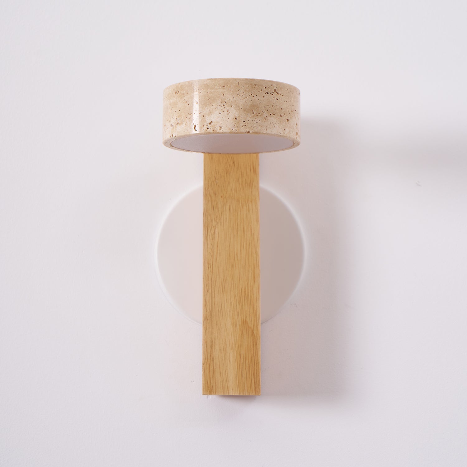 Wall-mounted light fixture with wooden base and terracotta-colored top on a white background