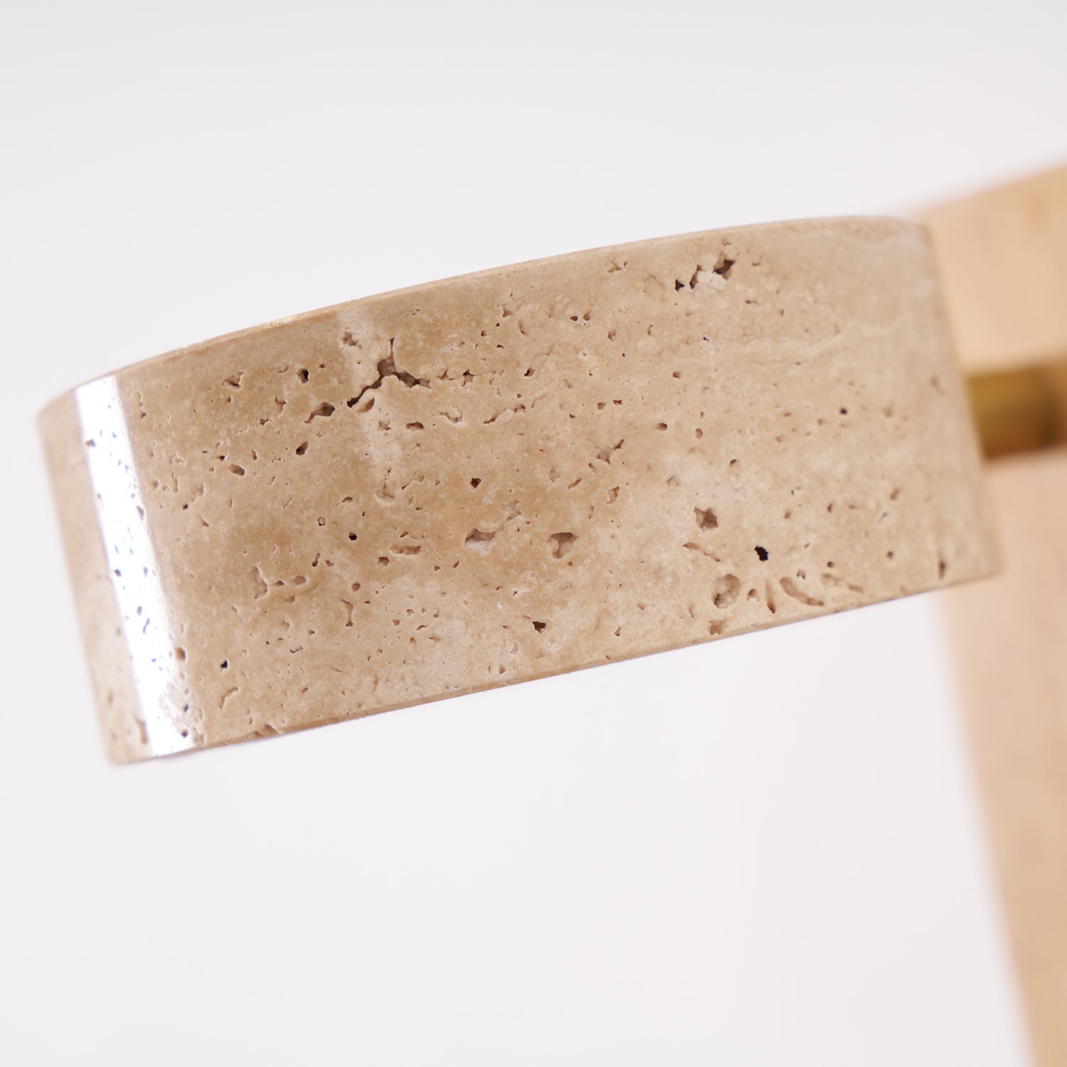 Beige stone bar with silver accent on a white background