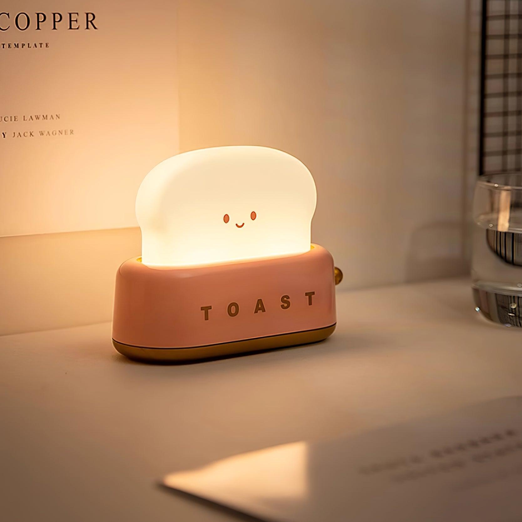 Cute toast-shaped night light on a surface with a blurred background