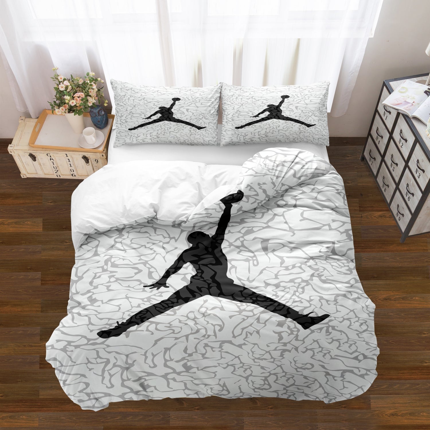 Bedding set with Jordan logo on a bed in a room setting