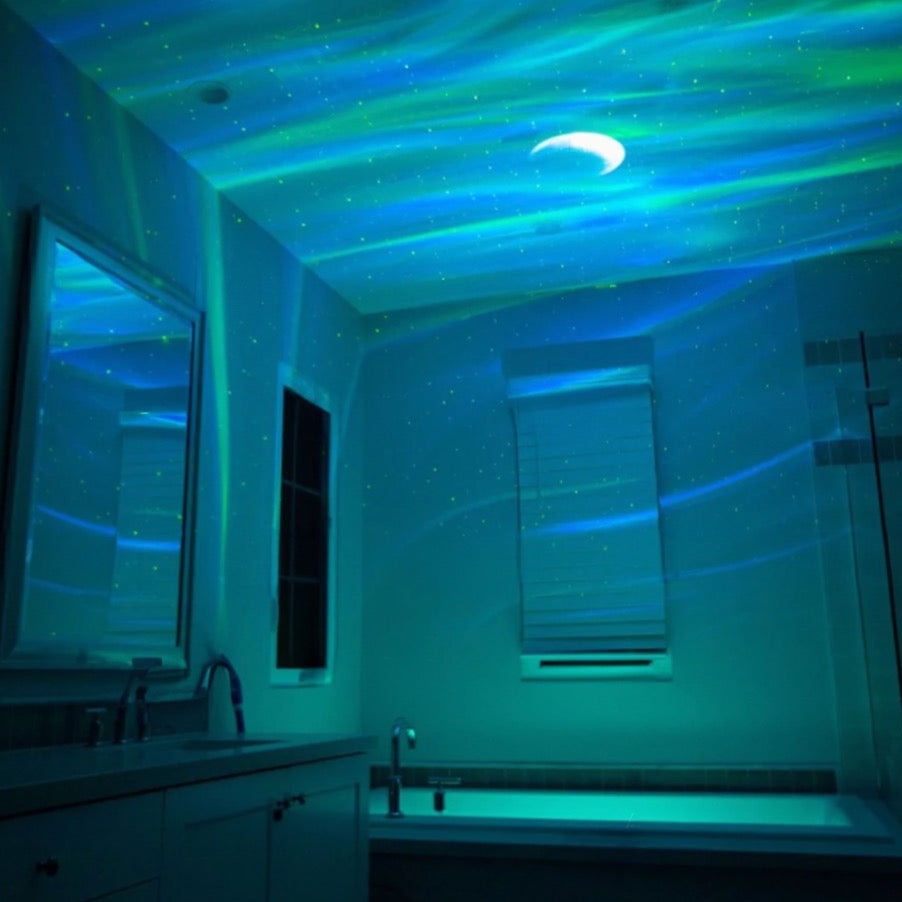 Bathroom with starry night light projection on ceiling
