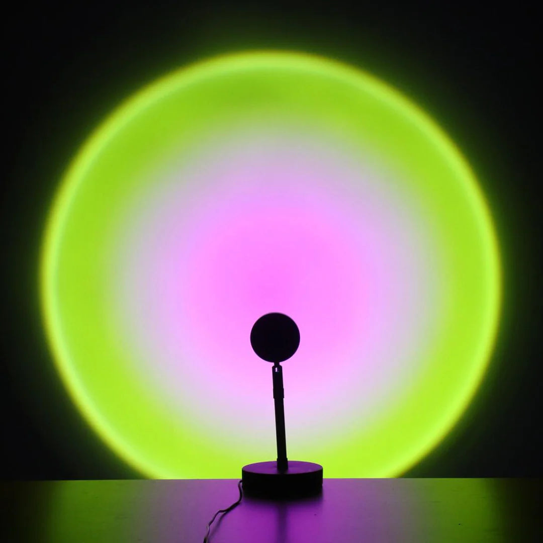 Silhouette of a lamp with a glowing green and pink circular light in the background