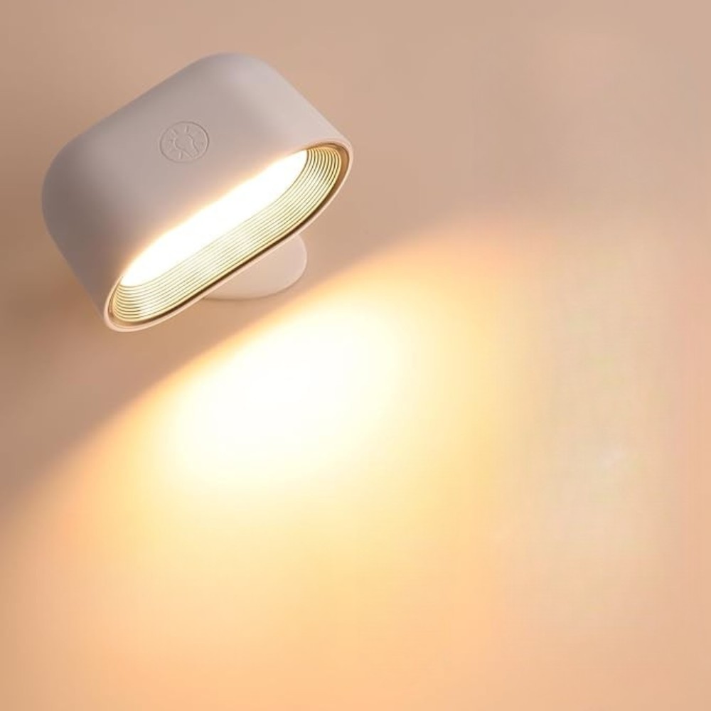 White wall light fixture on a beige background