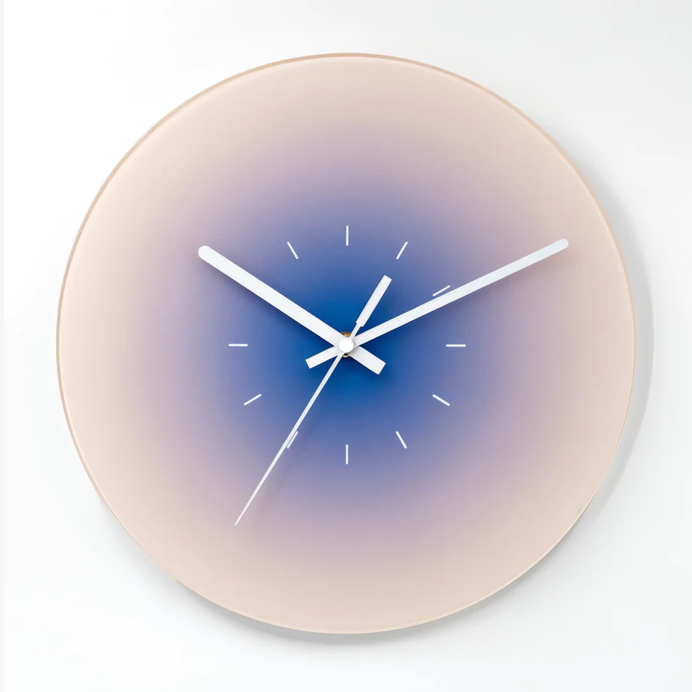 Round wall clock with a gradient design on a white background