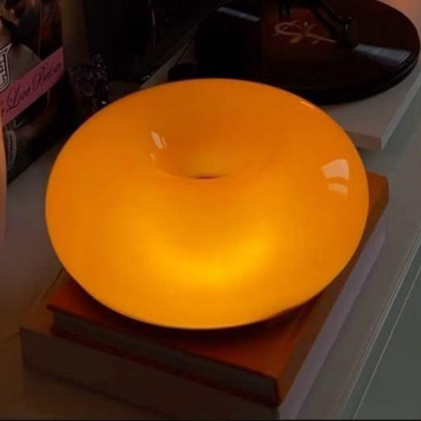 Orange lamp on a surface with a blurred background