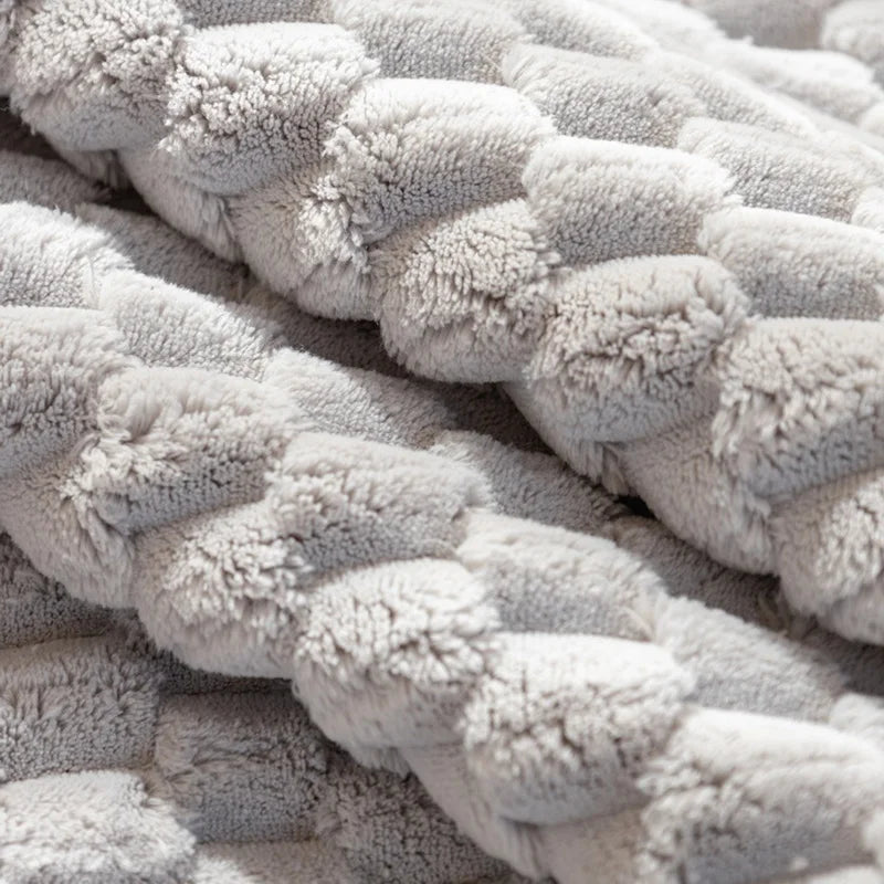 Close-up of textured beige fabric with a braided pattern