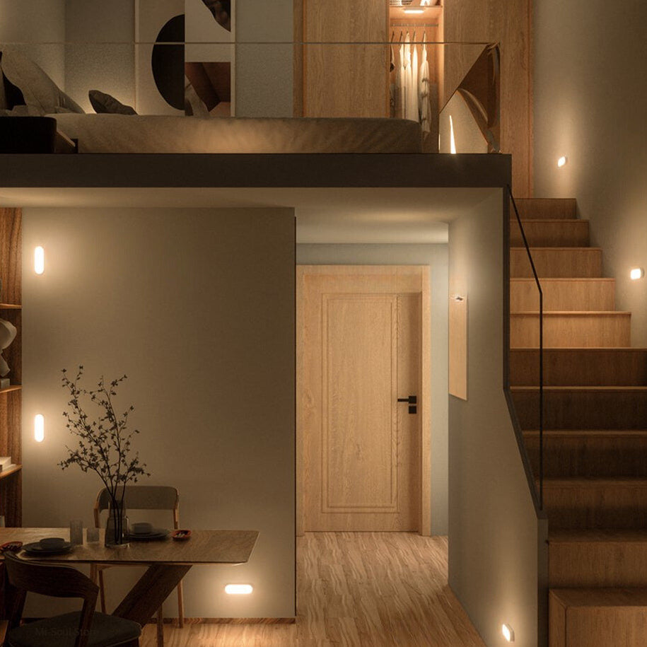 Modern interior design with a staircase, desk, and wall art in a cozy setting.