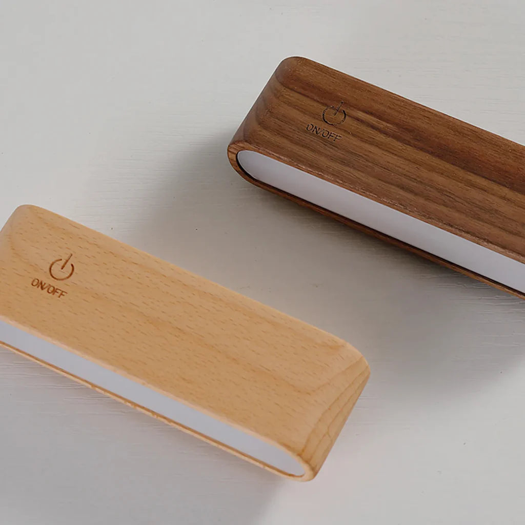 Two wooden power banks with 'ON/OFF' switch on a light gray background
