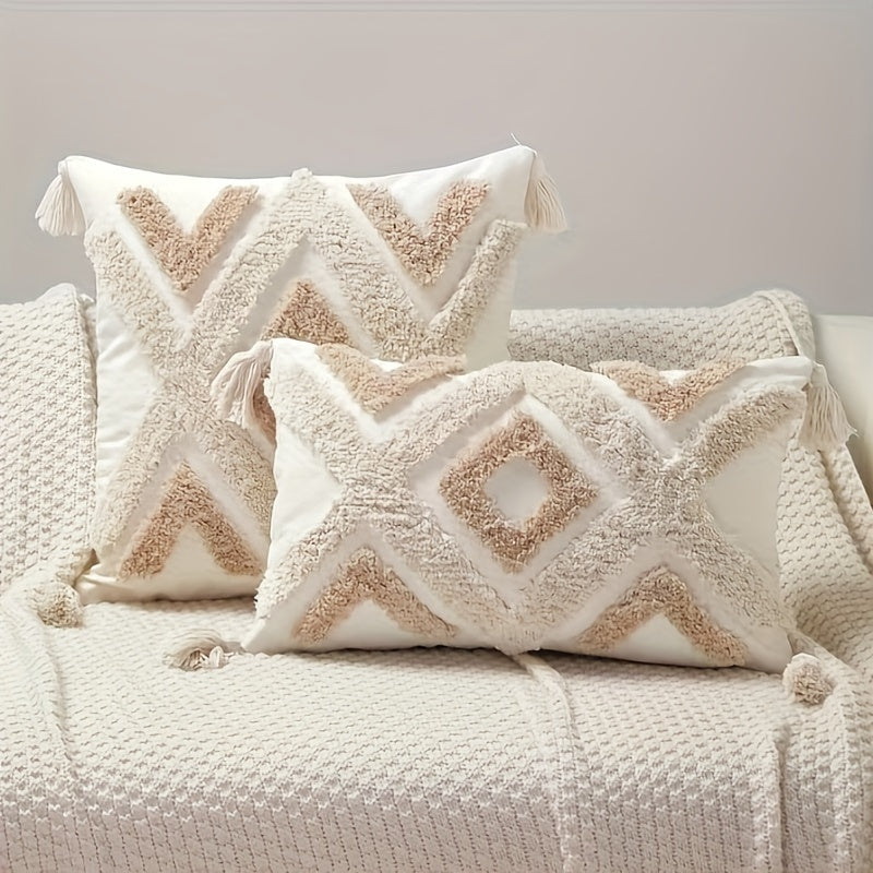 Decorative pillows with geometric patterns on a textured surface