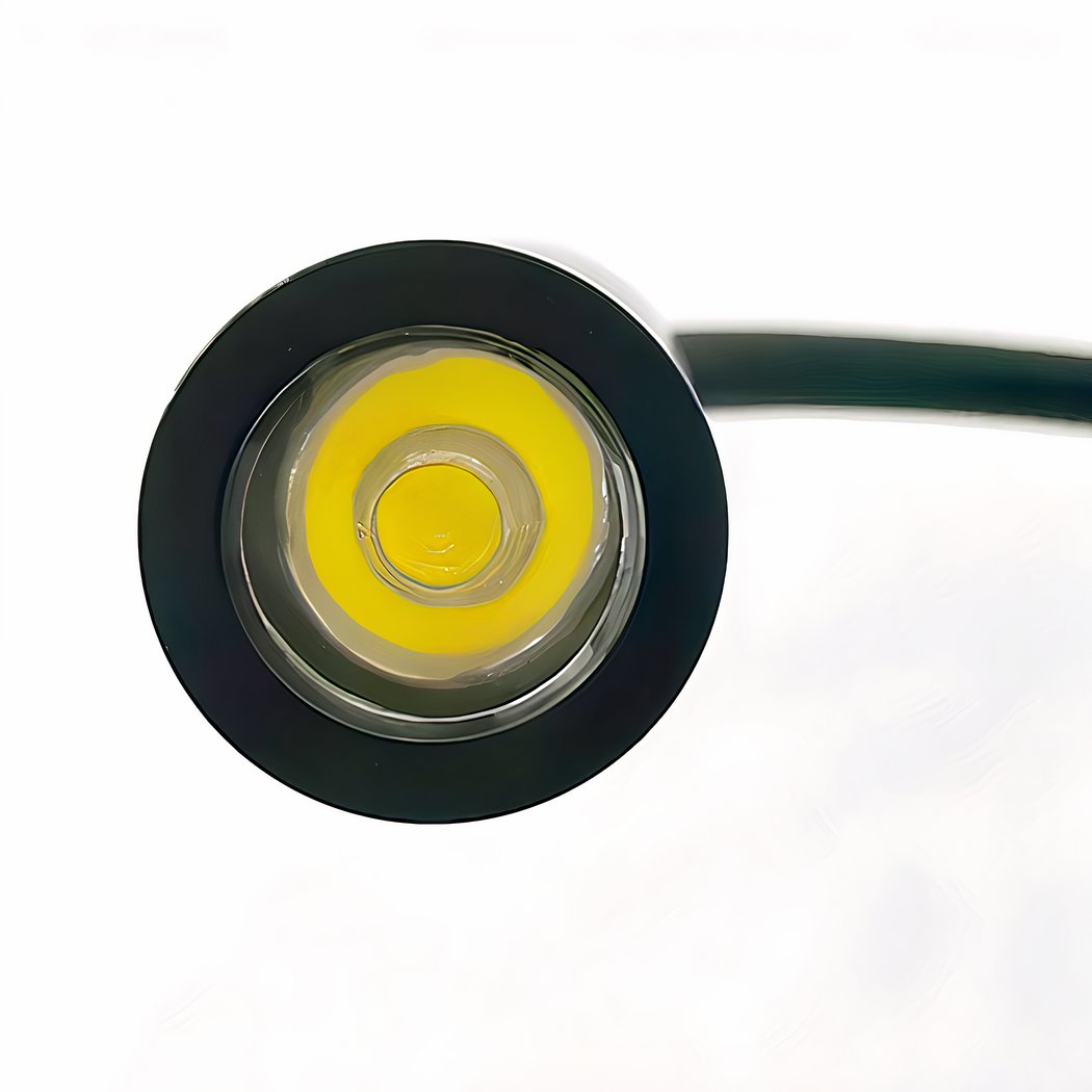 Close-up of a circular component with yellow center and black rim on a white background