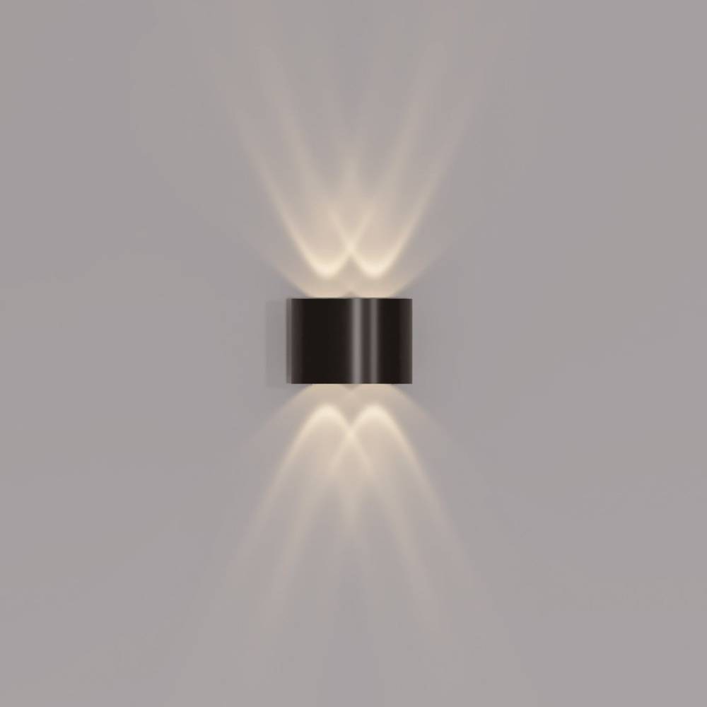 Modern wall-mounted light fixture on a gray background