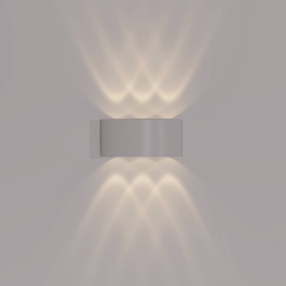 Modern wall-mounted light fixture on a plain wall