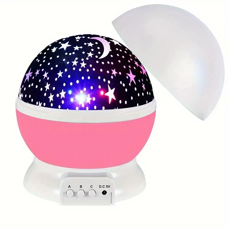 Starry night light projector with pink base and white top on a white background