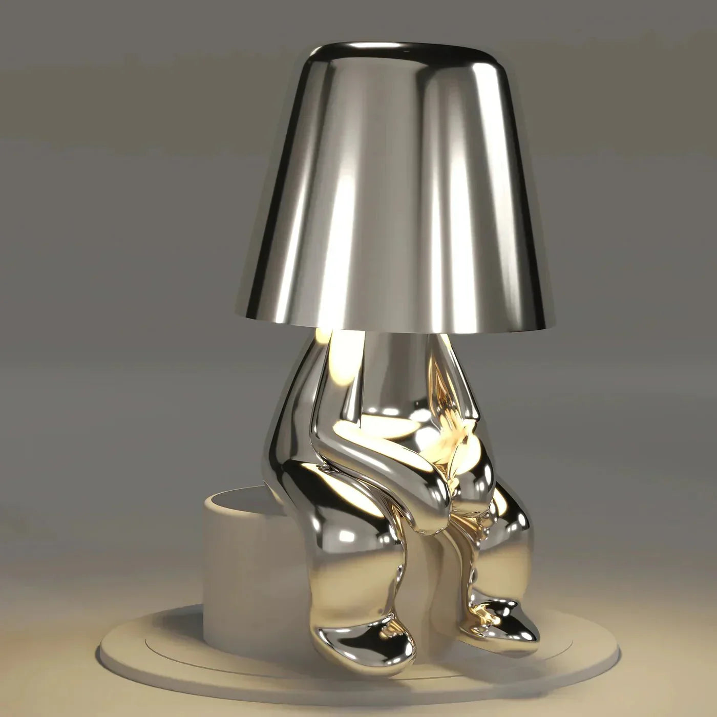 Silver metallic lamp with a unique design on a neutral background
