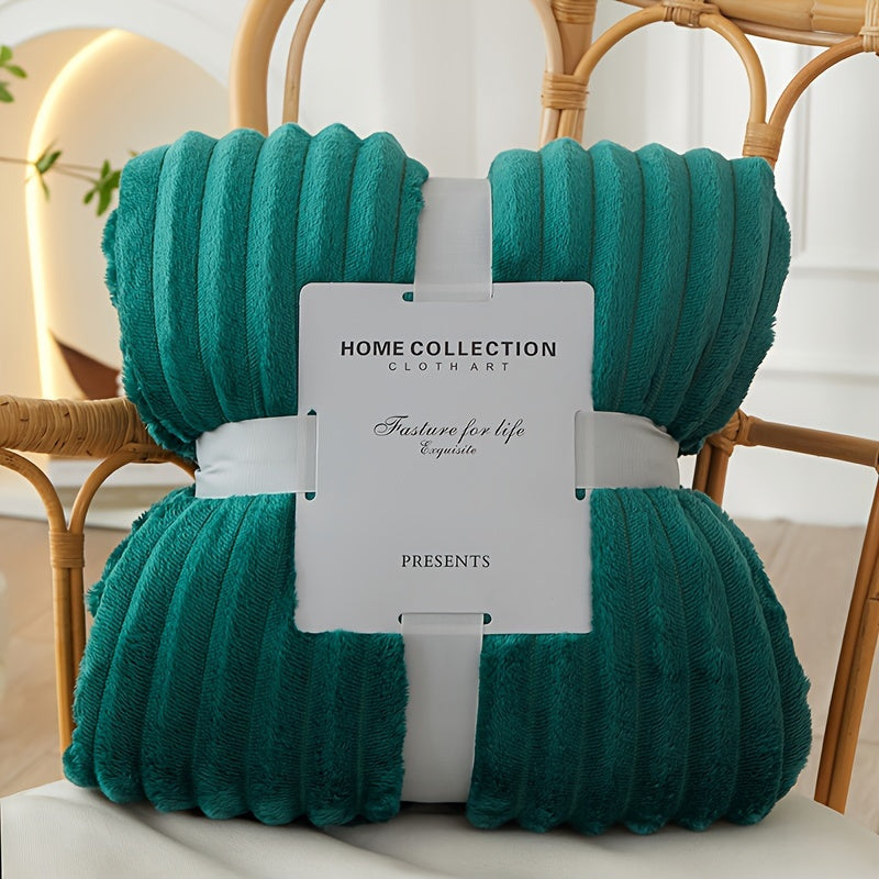 Teal yarn skein with a 'Home Collection' label on a chair.