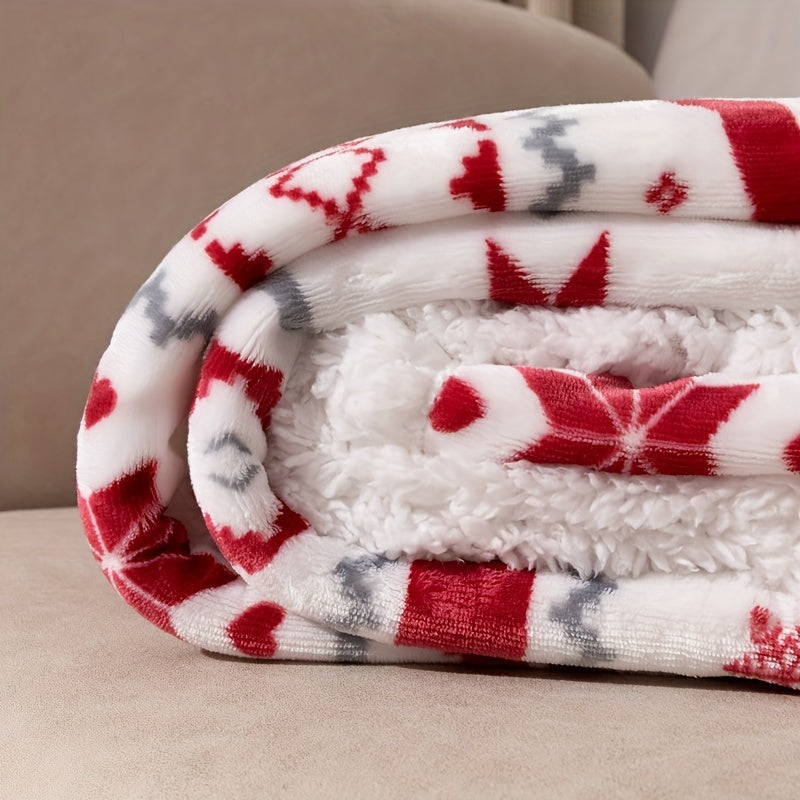 Folded blanket with red and gray diamond pattern on a beige surface