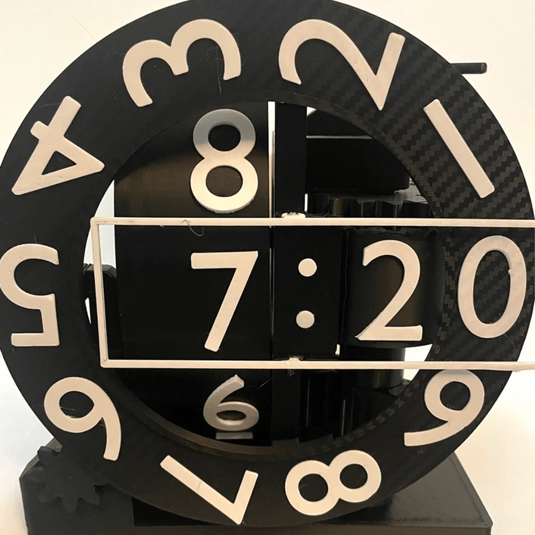 Black clock with beige numbers on a white background