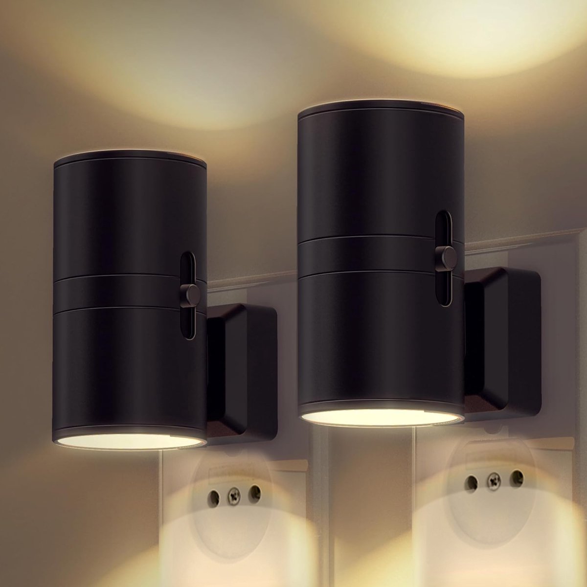 Two black cylindrical wall lights on a neutral wall.