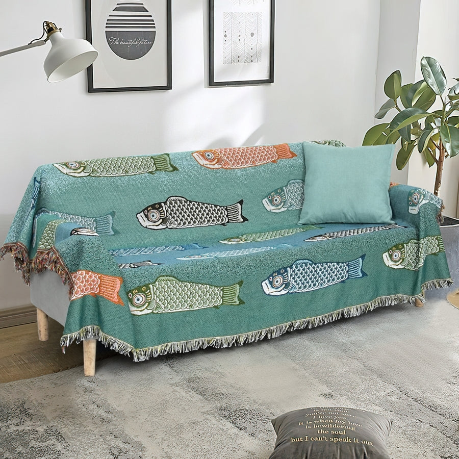 Sofa with a fish-patterned cover in a living room setting