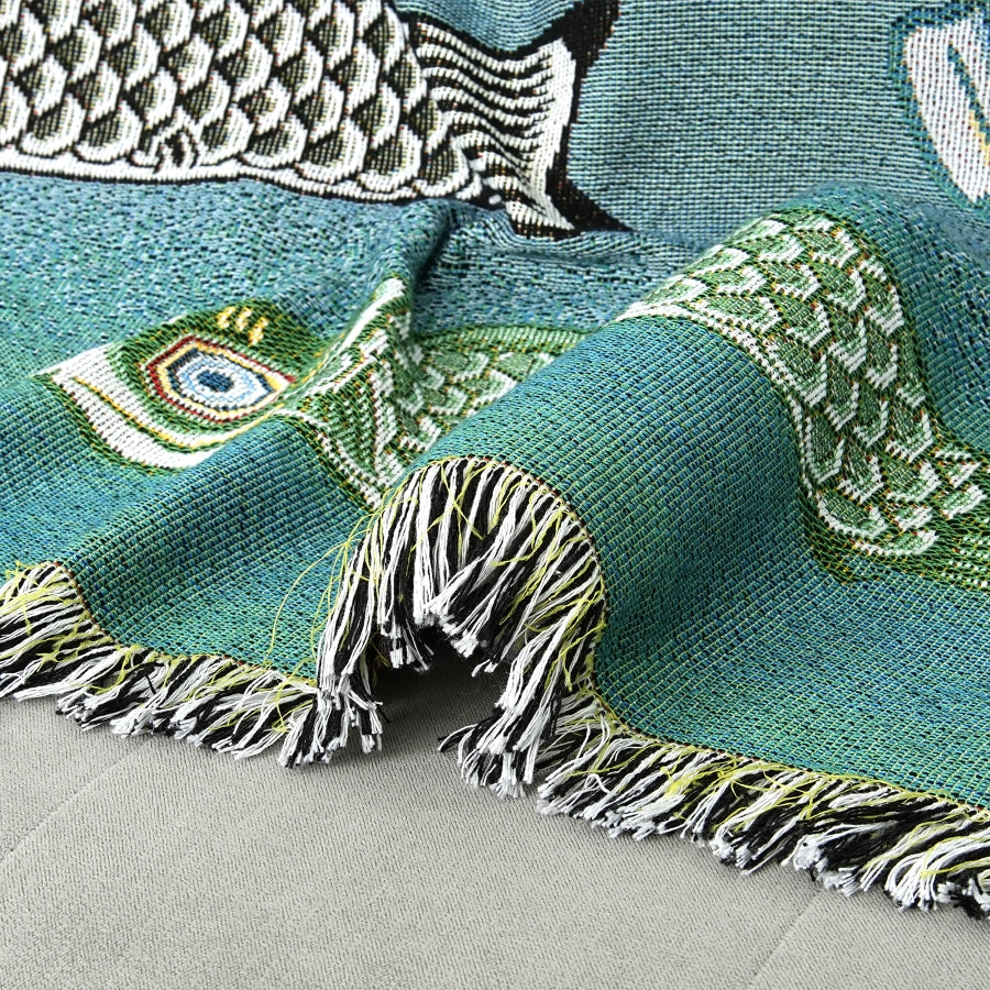 Textile with fish patterns on a teal background