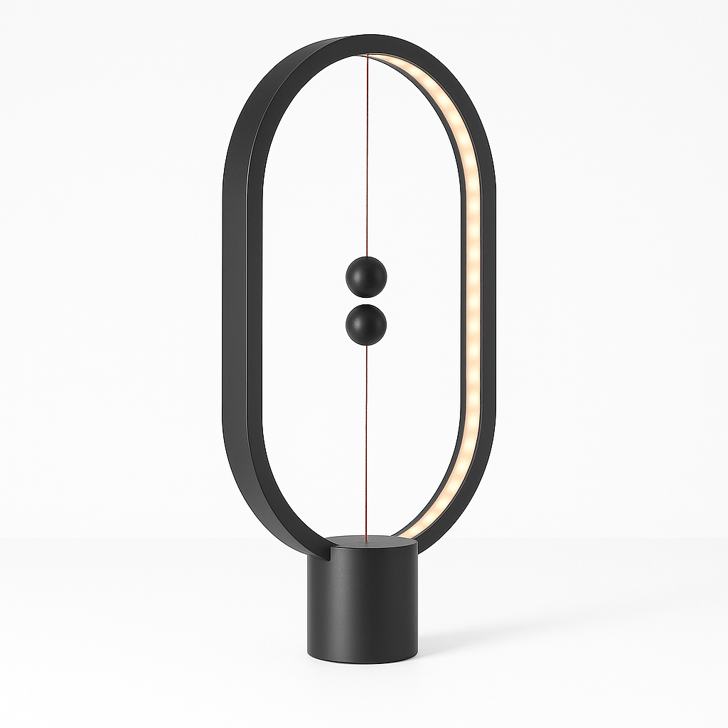 Modern black balance lamp with circular design on a white background