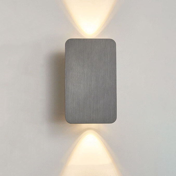 Square wall light fixture on a plain wall
