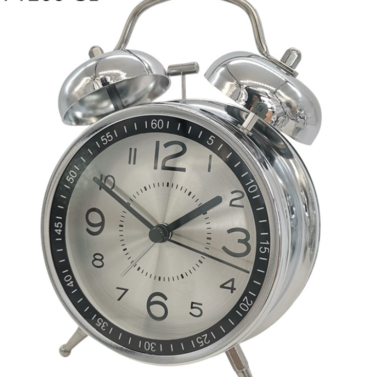 Silver alarm clock with black numbers on a white background