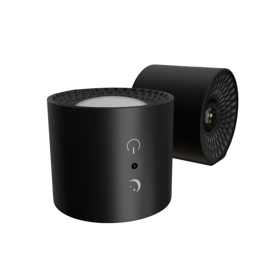 Black cylindrical device with control buttons on a white background