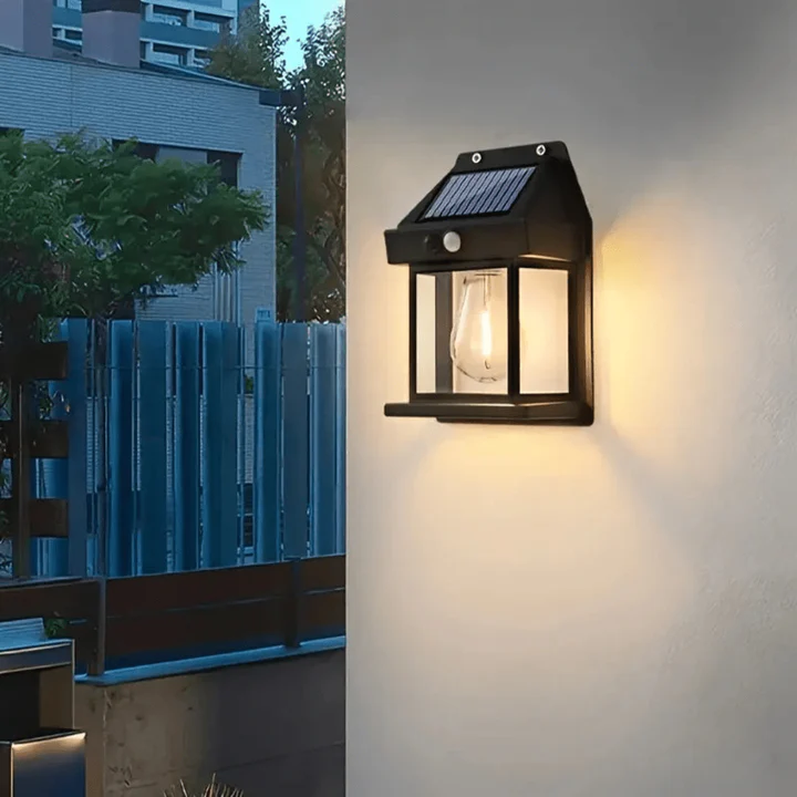 Solar-powered outdoor wall light fixture on a building exterior.