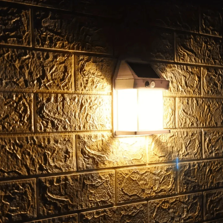 Solar wall light fixture on a textured brick wall