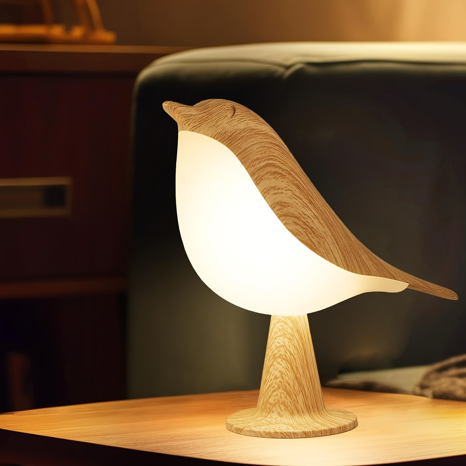 Bird-shaped lamp on a wooden surface with a blurred background