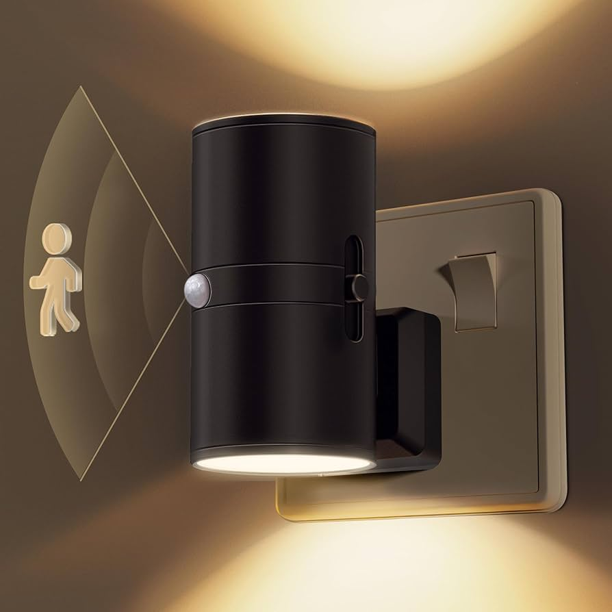 Black wall-mounted light fixture with motion sensor on a brown background