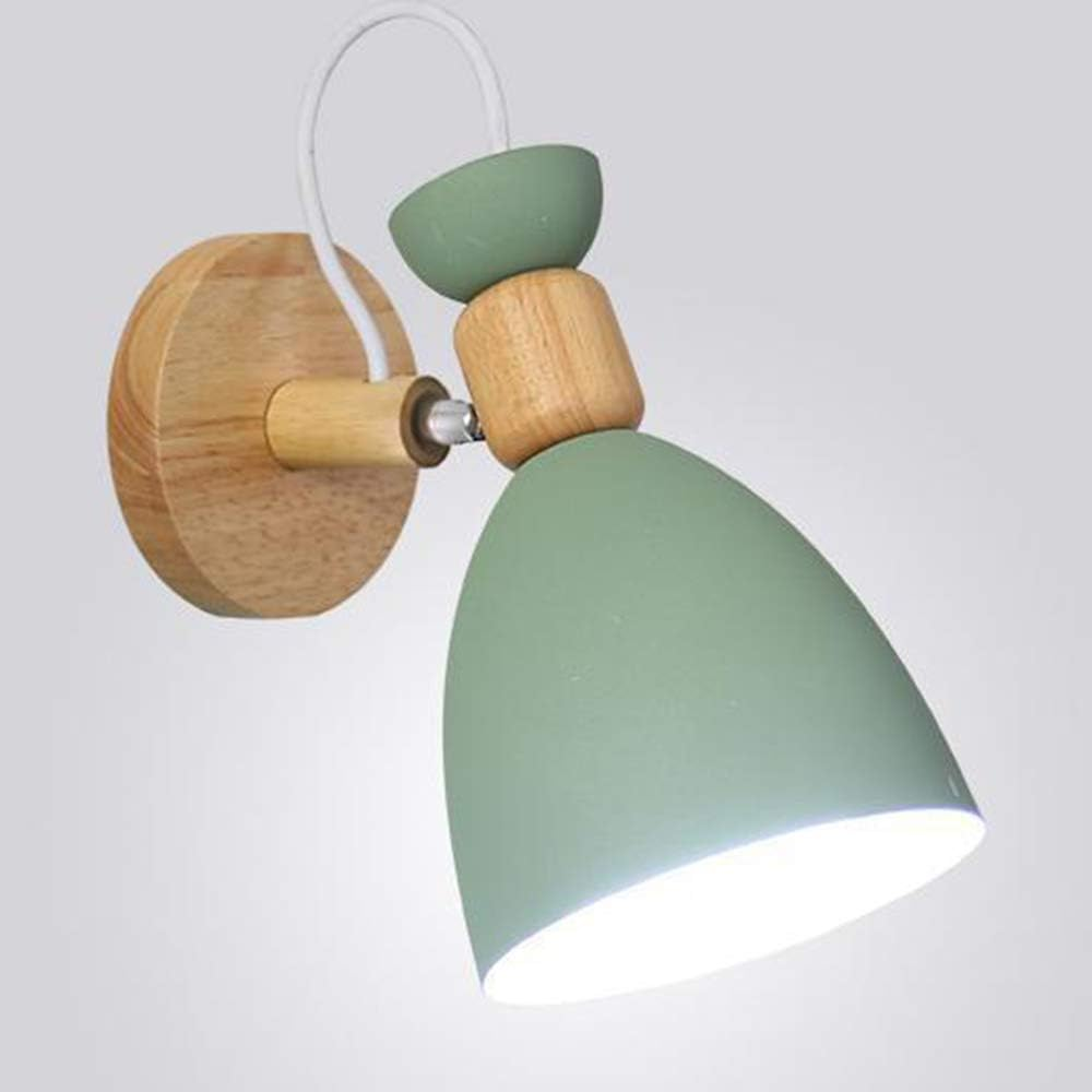 Wall-mounted lamp with green shades and wooden accents on a light gray background