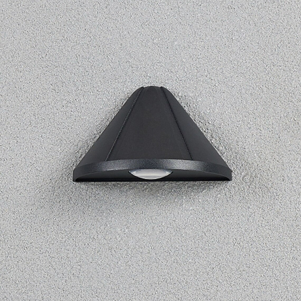 Black outdoor wall light fixture on a gray concrete wall