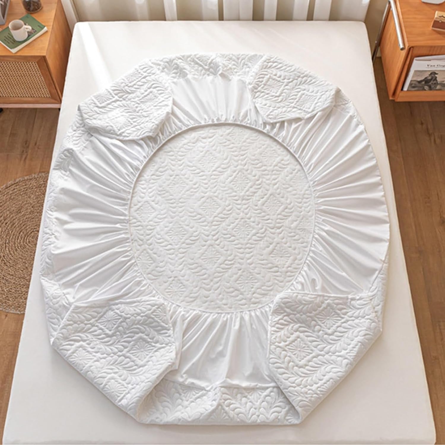 White fitted sheet on a bed in a bedroom setting