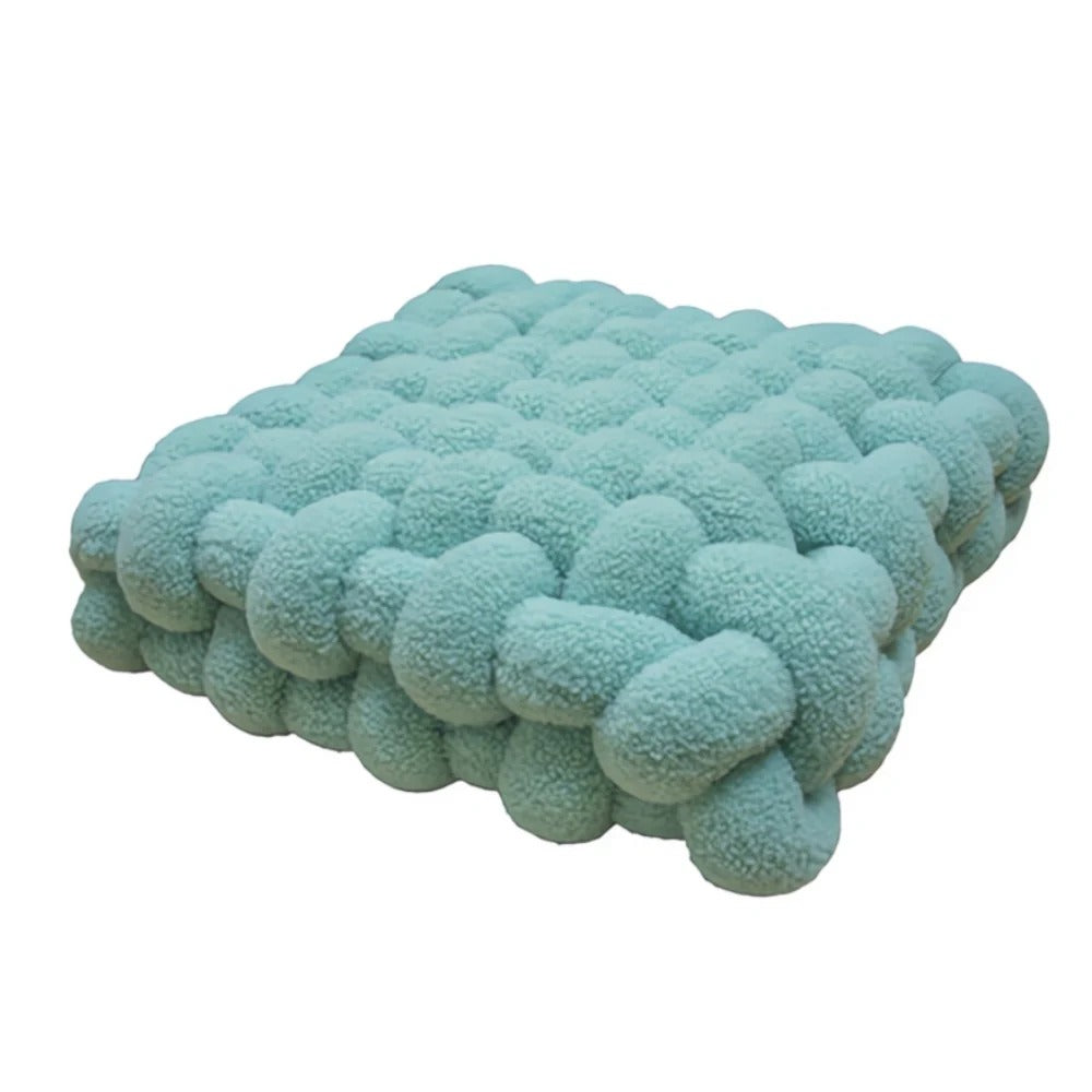 Turquoise textured blanket on a white background