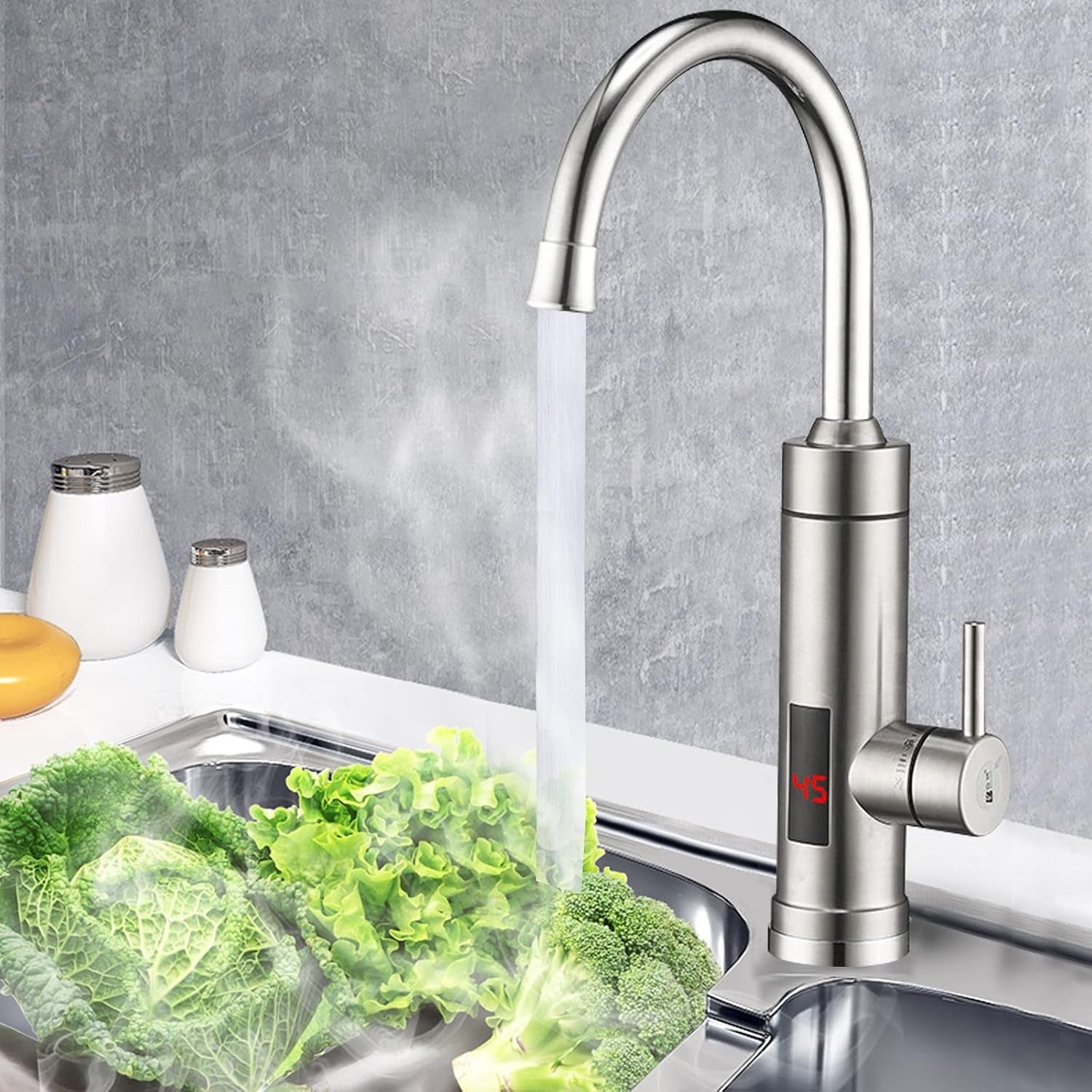 Modern kitchen faucet with water flowing into a sink, surrounded by fresh vegetables.