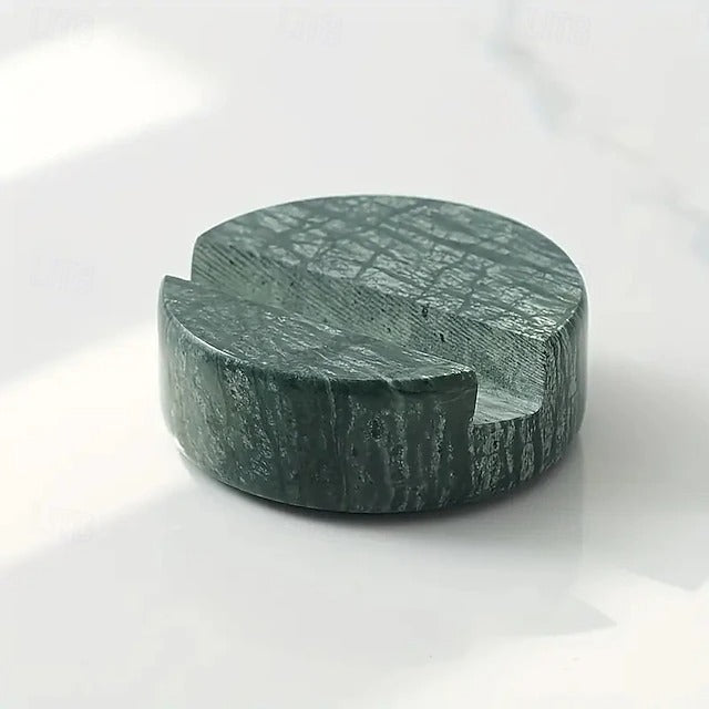 Green stone with a unique texture on a white background