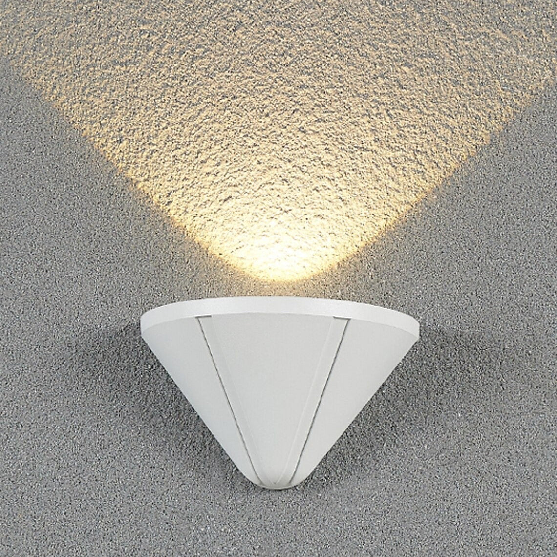 White triangular wall light fixture on a textured gray wall.