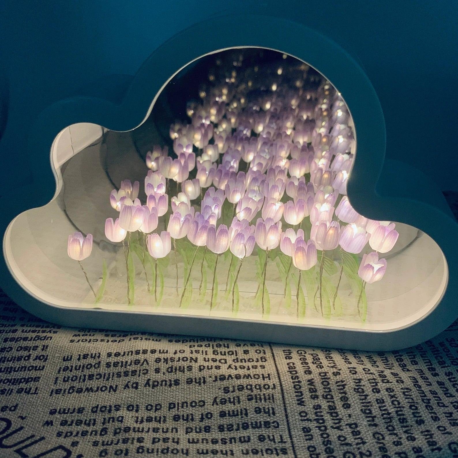 Decorative cloud-shaped lamp with purple tulips on a blue background