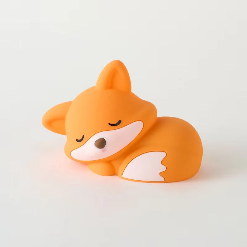 Orange fox-shaped toy on a light gray background