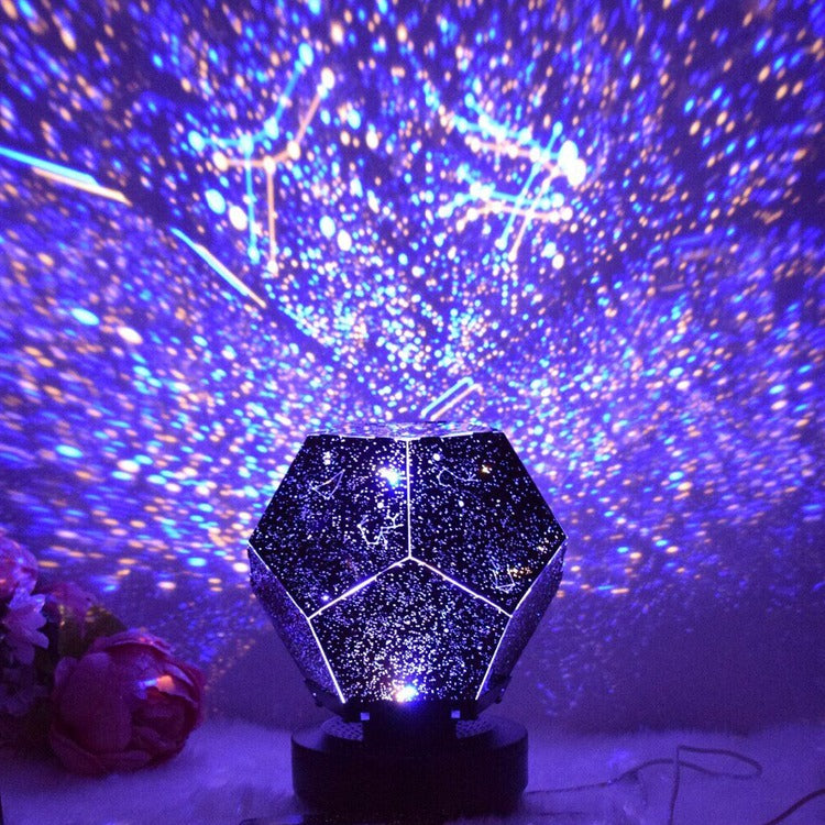 Starry night light projector with a geometric design on a dark background