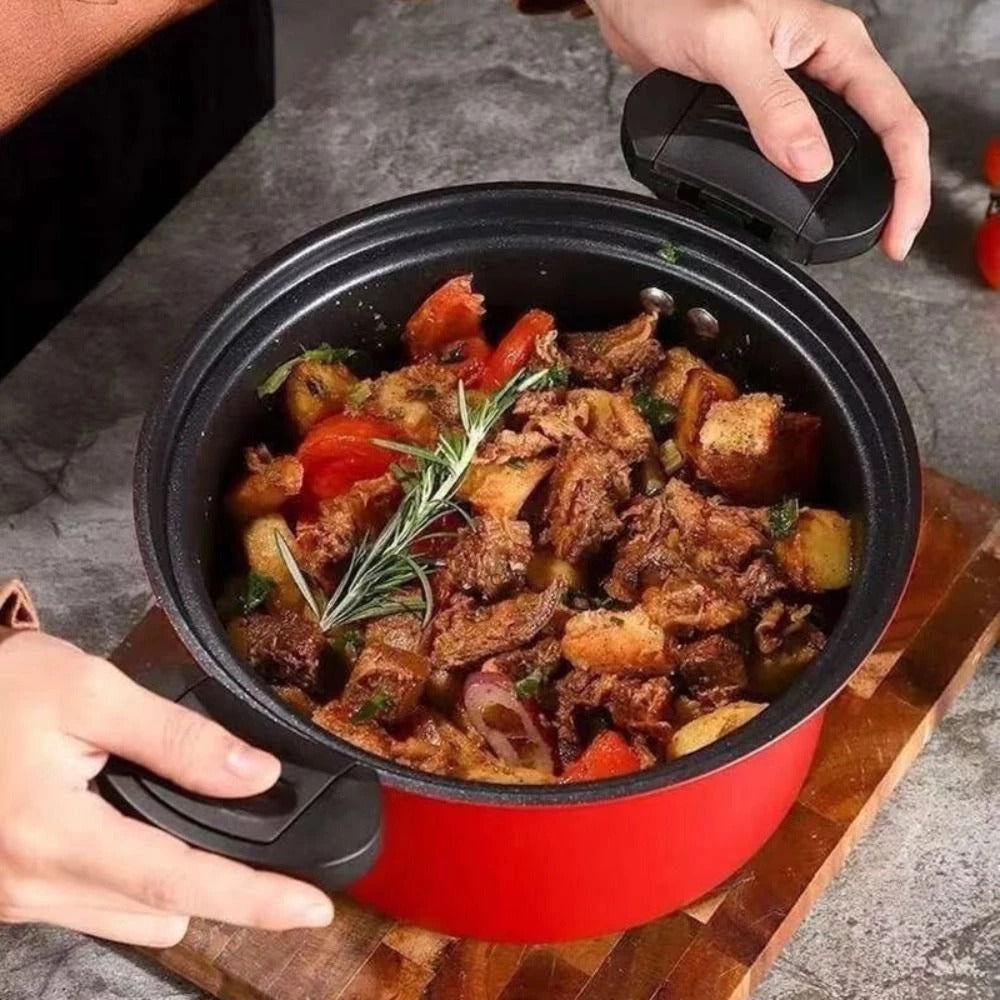 Red and black pot with a stew on a wooden board