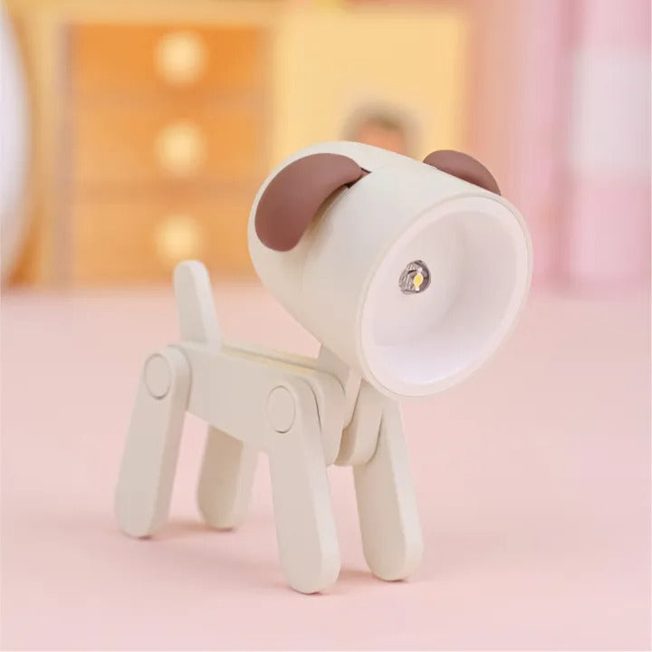 White dog-shaped night light with brown accents on a pink background