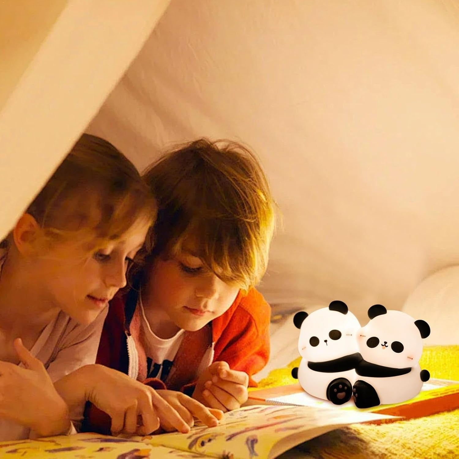 Two children reading a book under a lamp with two panda-shaped night lights on the side.