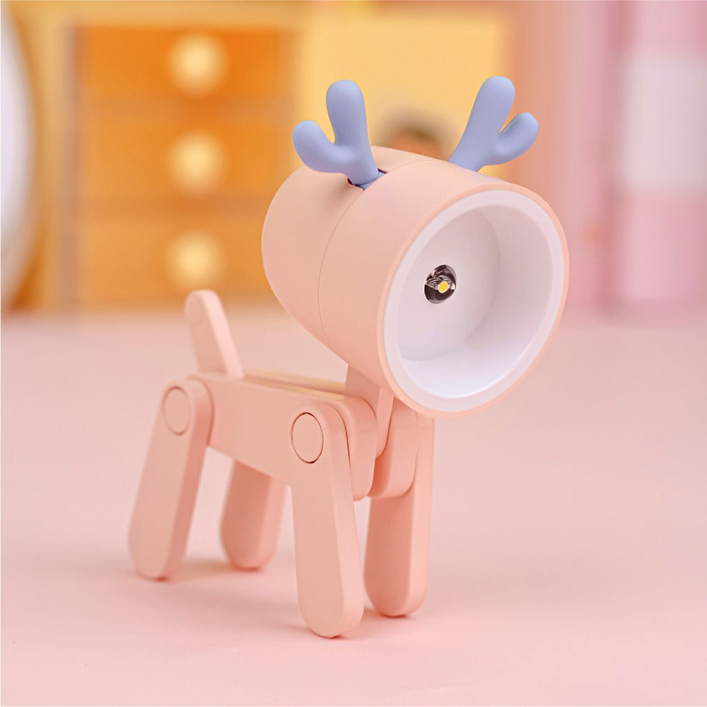 Pink reindeer-shaped lamp on a soft pink background