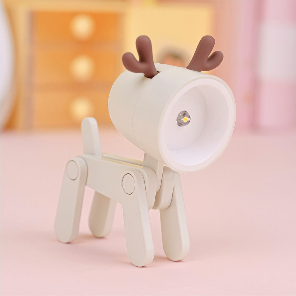 Deer-shaped night light on a soft pink background