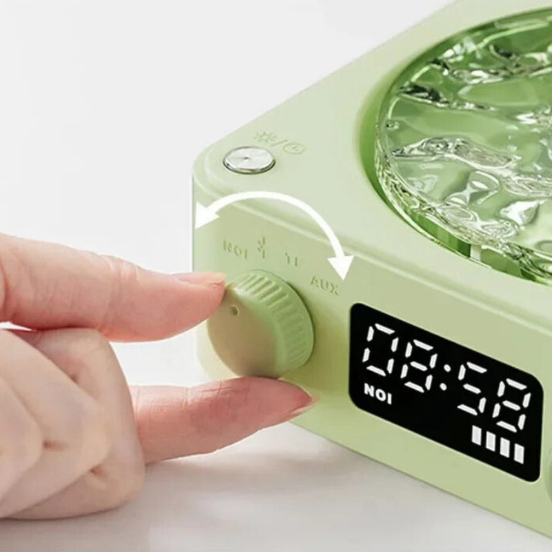 Green electronic device with digital display and control knobs on a white background